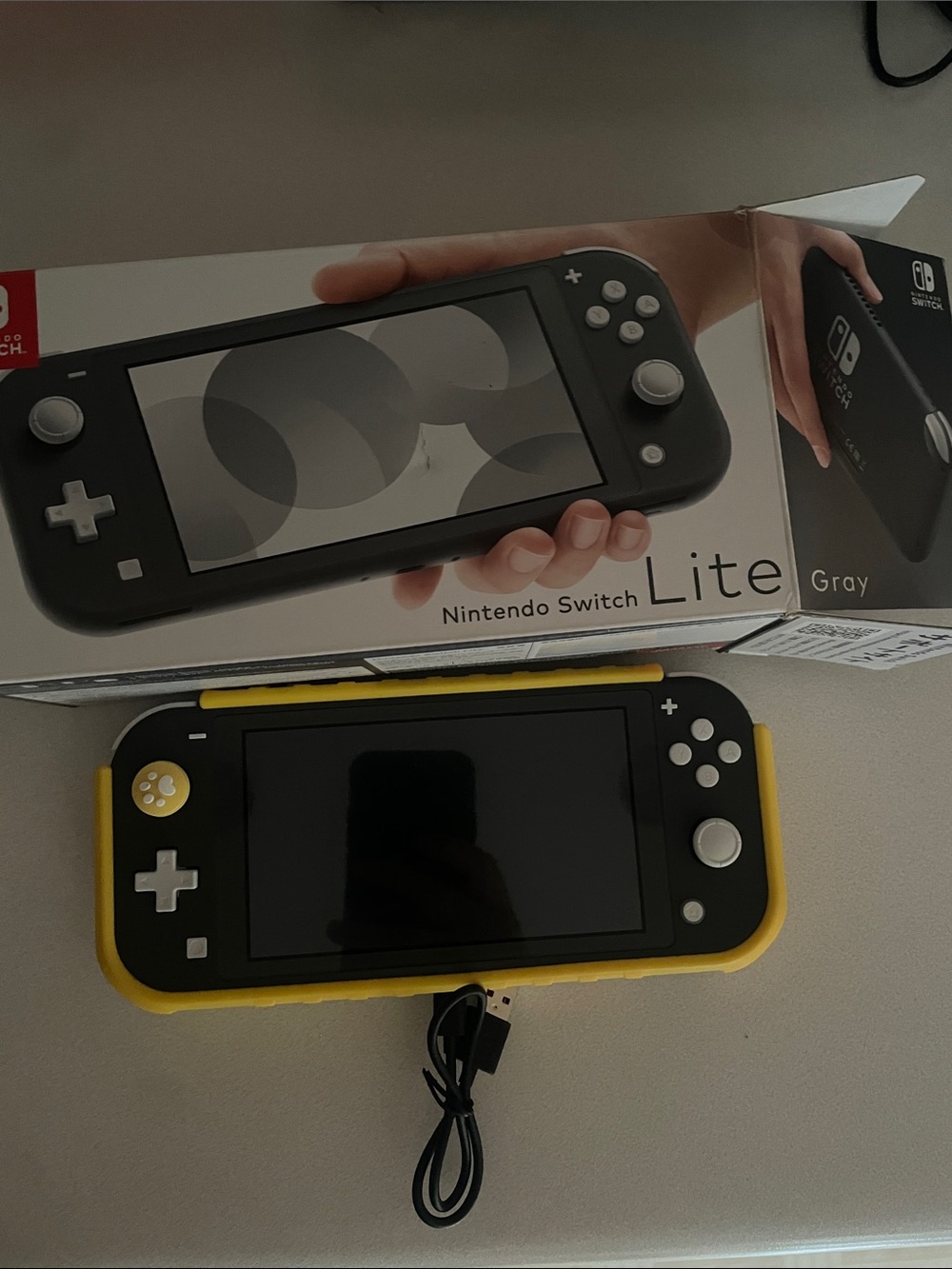 Nintendo Switch Lite Gray with Yellow Case with game